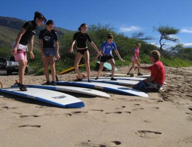 Surf-Instructor-Maui-helping-students-min-scaled-