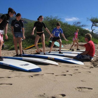 Surf-Instructor-Maui-helping-students-min-scaled-