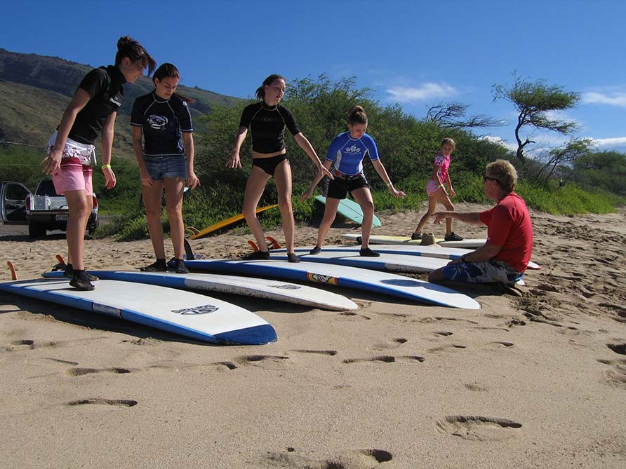 Surf-Instructor-Maui-helping-students-min-scaled-