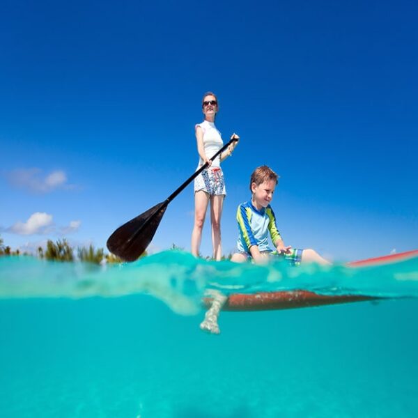 woman and son paddle boarding Maui